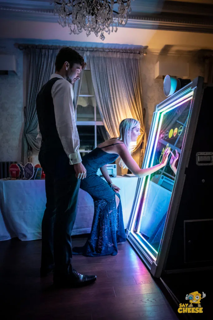 A couple posing at the Magic Mirror
